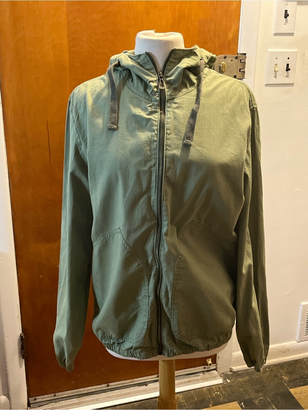 Denim & Flower olive green hooded lightweight zip-up jacket And drawstring hood.